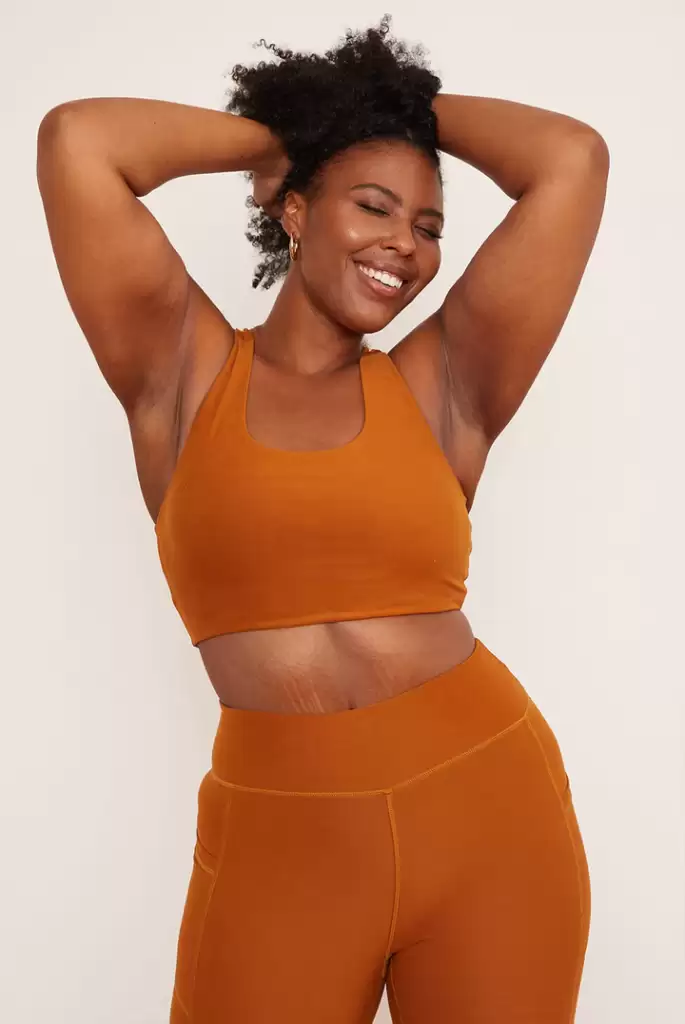 Wolven Turmeric Yoga Top is made from 84% rPET (recycled polyester) $56