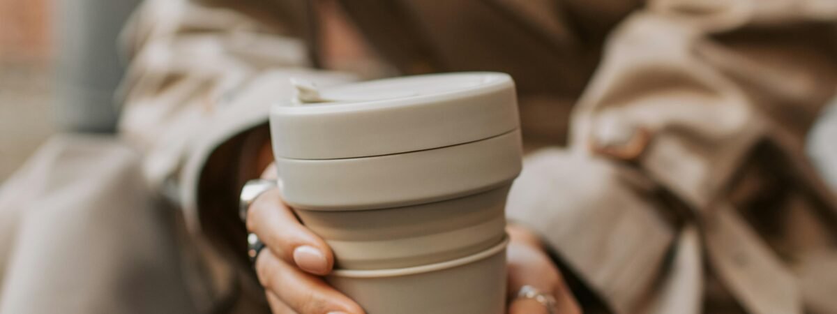An estimated 50 billion single-use coffee cups are thrown into landfills yearly. Carrying a reusable one can reduce paper and plastic waste. Image Vlada Karpovich